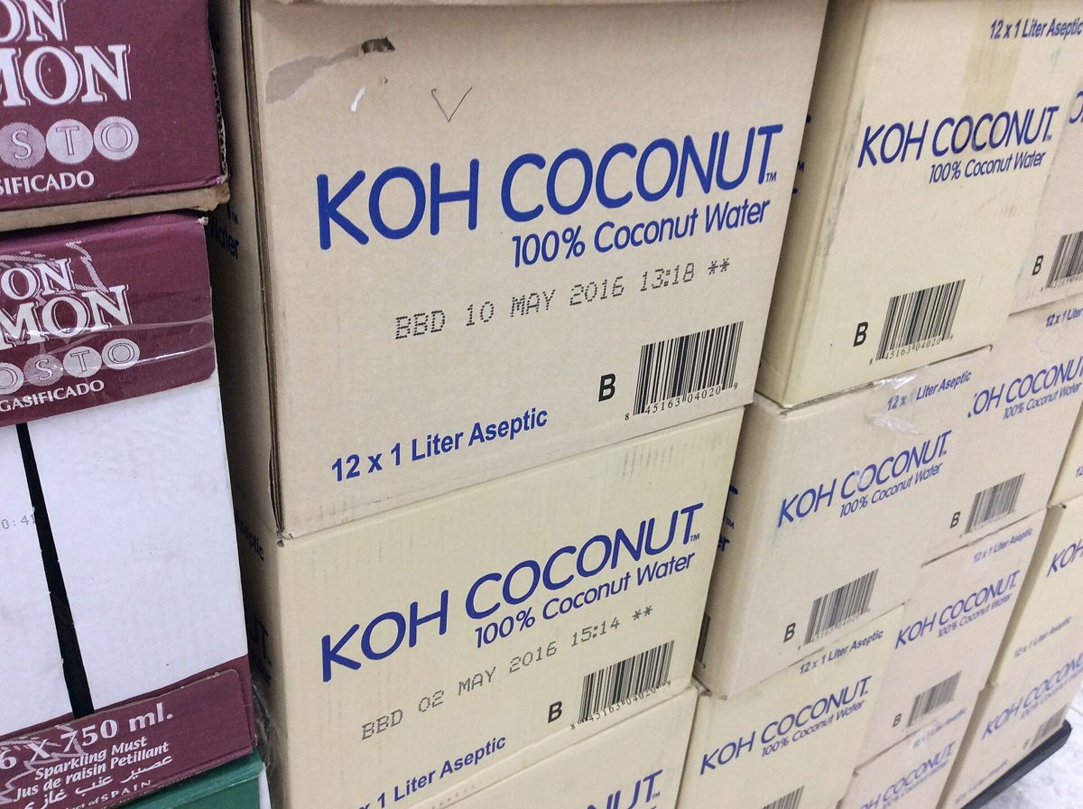 A pile of boxes containing KOH coconut